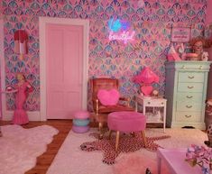 a room with pink walls and furniture in the center is decorated like a mermaid's tale