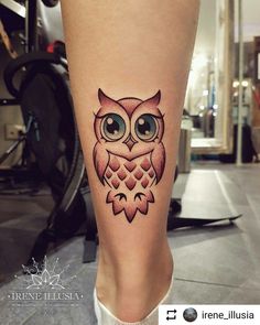 an owl tattoo is shown on the leg