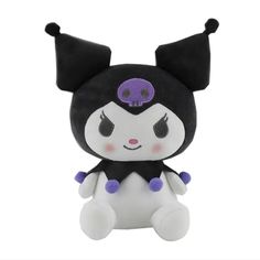 a black and white stuffed animal with purple eyes