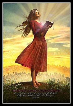 a woman standing on top of a hill holding a book