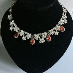 Regency Revival! Dress to impress! This is a Rhinestone necklace with Ruby red coloured drops. Good to go with your own great outfit for your next Jane Austen Ball, Bridgerton event Or at a Wedding, Birthday, Christmas or New Year's do. Red Dangle Necklaces For Party, Red Rhinestone Necklace For Party, Red Rhinestone Necklace For Gift, Teardrop Crown Jewelry With Rhinestones For Parties, Red Crystal Dangle Jewelry, Red Teardrop Necklace For Party, Red Rhinestone Party Necklaces, Red Drop Beads For Jewelry Making, Red Jeweled Rhinestone Necklace For Party