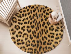 an animal print rug is on the floor next to a teddy bear