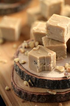 several pieces of fudge are stacked on top of each other with walnuts around them