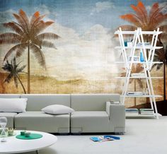 a living room with palm trees painted on the wall and a ladder leaning against the wall