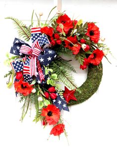 a wreath with red, white and blue flowers