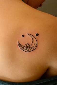 a woman with a crescent tattoo on her back and stars in the sky above it