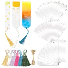 several different types of paper with tassels on them