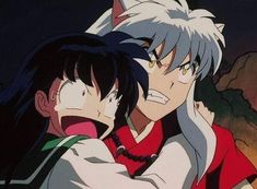 two anime characters are hugging each other