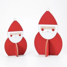 two wooden santa claus ornaments on white background