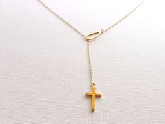 A beautifully detailed Lariat Cross Necklace, hand crafted in sterling silver. This pendant comes with a delicate silver link chain with our shops insignia; a charm of a key with the letter V at the clasp. This unique necklace will make the perfect gift for anyone. Material: Sterling Silver Pendant Size: about 1 inch Chain Length: 18 inch Silver Link Chain with 1 inch extension *All purchases will arrive in a gift box! *Available in silver, Rose gold plated and yellow gold plated versions. Other Classic Lariat Necklace Gift, Classic Lariat Necklace For Gifts, Classic Sterling Silver Lariat Necklace Gift, Lariat Necklace With Polished Finish As Gift, Polished Lariat Necklace For Gift, Polished Finish Lariat Necklace For Gift, Classic Gift Lariat Necklace With Delicate Chain, Classic Lariat Necklace With Delicate Chain For Gift, Classic Gold Lariat Necklace Perfect For Gifts