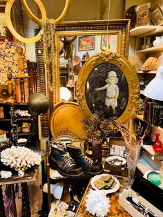 a room filled with lots of different types of items and decor on the floor, including shoes