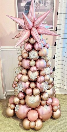 a christmas tree made out of balls and ornaments