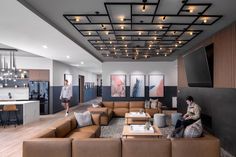 a living room filled with lots of brown furniture