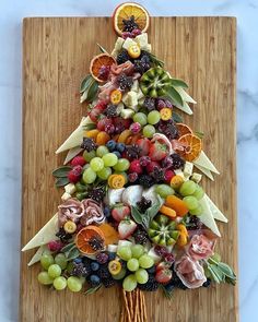 a christmas tree made out of fruits and vegetables