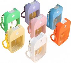 four different colored cell phones are shown in the same color and shape, with one being held by a lanyard