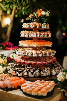 an assortment of sushi is displayed on a table