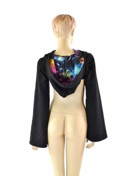 "This item is made to order, please read all the way through the listing before purchasing! This bolero top is made of soft, matte black zen knit. It is breathable and stretchy, with a great weight and drape. The hood is lined in UV glow galaxy print, and the long sleeves have a wide, Bell cut. (Crop tank and cheekies sold separately) We can create these in any color or print shown in the shop. If you do not see what you want, please ask! Womens Sizing (See below for instructions on where measur Fitted Winter Tops For Cosplay, Rave Style Fitted Top For Cosplay, Fitted Rave Top For Cosplay, Black Rave Style Top For Cosplay, Black Rave Top For Cosplay, Sleeve Bolero, Bolero Top, Galaxy Print, Rave Festival