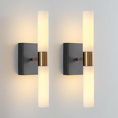 two lights that are on the side of a wall