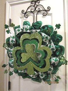 a shamrock wreath hanging on the front door