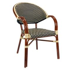 a black and white patterned chair with wooden arms