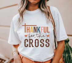 A Thankful Thanksgiving T-shirt that exudes warmth and gratitude, perfect for celebrating the holiday with loved ones. The classic fit and medium fabric ensure year-round comfort, while the tear-away label adds convenience and scratch-free wear. Ideal for anyone looking to add a festive touch to their wardrobe during the Thanksgiving season. Product features - Made from 100% US cotton for sustainability - Classic fit for a comfy and relaxed wear - Tear-away label for scratch-free experience - Et Thankful Shirt Ideas Vinyl, Fall Season T-shirt Gift, Fall Gift T-shirt With Short Sleeves, Short Sleeve T-shirt For Fall Gift, White T-shirt For Fall Season Gift, White T-shirt For Fall Gift, White T-shirt As A Fall Gift, Casual Thanksgiving T-shirt With Letter Print, Letter Print T-shirt As Fall Gift