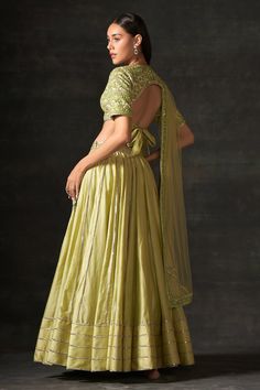 Mint green attached cancan lehenga in chanderi base with stripe pattern. Paired with floral embroidered padded blouse and dupatta.
Component: 3
Pattern: Embroidered
Type Of Work: Floral
Neckline: V neck
Sleeve Type: Half
Fabric: Lehenga- chanderi, Blouse and Dupatta- Net 
Color: Green
Other Details: 
Blouse-Hooks at the back
Lehenga-Zipper at side seam
Attached lining
Back tie-up
Lehenga Length (in inch): 42-43
Occasion: Wedding - Aza Fashions Green Raw Silk Lehenga For Reception, Anarkali Style Pista Green Raw Silk Lehenga, Anarkali Lehenga In Pista Green Raw Silk, Pista Green Anarkali Lehenga In Raw Silk, Floor-length Green Art Silk Sets, Green Floor-length Art Silk Set, Designer Green Tissue Silk Choli, Green Anarkali Choli In Tissue Silk, Anarkali Green Tissue Silk Lehenga