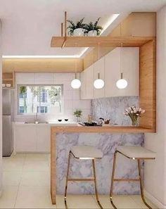 a kitchen with marble counter tops and stools