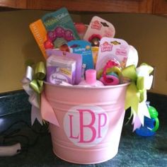 a pink bucket filled with lots of items