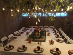 a table set up with plates and place settings