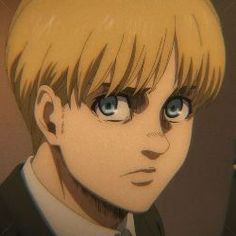 an anime character with blonde hair and blue eyes looks at the camera while wearing a suit