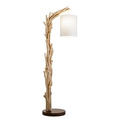 a wooden floor lamp with a white shade on the top and bottom part of it