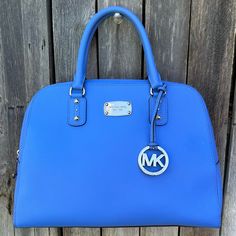 Michael Kors Boston Large Satchel Bag In Heritage Blue Saffiano Leather Super Cute Ultra Chic Classic Satchel Bag With Crossbody Strap In Bold Pop Bright Periwinkle Blue Color Of Scratch Resistant Saffiano Leather Satchel Shoulder Straps Zipper Top Closure Removable Adjustable Crossbody Strap Hanging Logo Charm Hardware Logo Plaque Inside Zipper Pocket Inside Slip Pockets Feet On Bottom Silver Feet On Bottom Silver Hardware Leather Upper Minimalist Minimalism Maximalist Maximalism Capsule Preppy Blue Saffiano Leather Top Handle Bag, Blue Saffiano Leather Bag For Everyday Use, Formal Blue Michael Kors Bags, Blue Saffiano Leather Bag With Detachable Strap, Blue Saffiano Leather Travel Bag, Classic Blue Saffiano Leather Bag, Blue Saffiano Leather Bag For Formal Occasions, Elegant Michael Kors Blue Bag, Elegant Blue Michael Kors Bag