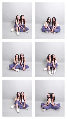 two women sitting on the floor with their arms around each other and posing for pictures