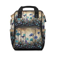 a bag with blue flowers and leaves on the front, it's zippered closure