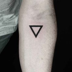 a black triangle tattoo on the left arm