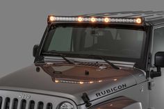 the front view of a jeep with its lights on