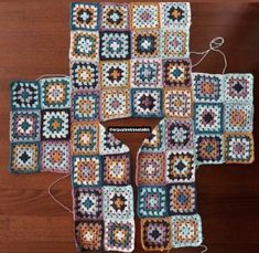 crocheted squares are arranged on top of each other