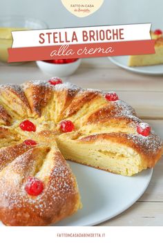 a white plate topped with a cake covered in powdered sugar and cherry toppings