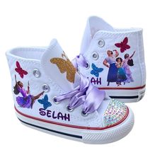 Her name in glittery purple, lavender satin laces, sparkly butterflies in turquoise, gold, and hot pink. She will love these shoes! Purple Canvas Shoes With Rubber Sole And Round Toe, Purple Canvas Shoes With Round Toe And Rubber Sole, Custom Sneakers With White Sole And Rubber Toe Cap, We Don't Talk About Bruno, Personalized Shoes, Purple Lavender, High Top Shoes, High Top, Talk About