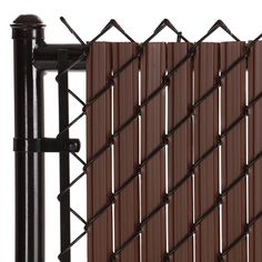 a close up view of a fence with brown plastic slats and black metal posts