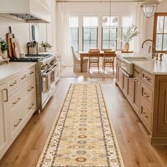 a large rug in the middle of a kitchen