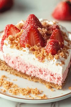 a piece of cake with strawberries on top and crumbs around the edges