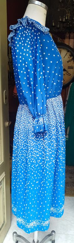 "Welcome! This is 80s Vintage Pleated and ruffled Dress In very good condition, this blue dress has a lot of details Smoke Free Made in France Not lining Size M Measures: - Shoulder to shoulder: 14.56\" (37 cm) - Slevees: 19.68\" (50 cm) - Chest: 39.37\" (100 cm) - Total Long: 44.09\" (112 cm) Thanks for stopping by!IMPORTANT: Due to the delicate situation We're all going through, and in order to keep the safety of courier workers too, all orders will be dispatched when alert sanitary finished. Blue Vintage Dress With Ruffles For Spring, Blue Long Sleeve Vintage Dress For Summer, Retro Blue Midi Dress For Spring, Blue Retro Midi Dress For Spring, Retro Blue Vintage Dress For Spring, Blue Retro Vintage Dress For Spring, Vintage Blue Midi Dress For Spring, Blue Vintage Midi Dress For Spring, Vintage Blue Pleated Dress