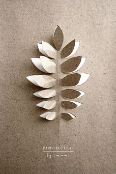 a paper cut leaf is on the wall