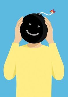 a person holding up a black object with a smiley face on it's head