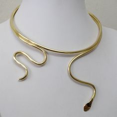 Snake Necklace, Snake Choker, Snake Jewelry, Gold Snake Necklace, Serpent Necklace, Brass gold plated, Sterling Silver 925,The14k Gold filled. Handmade minimal chic choker necklace made of Brass , Sterling silver 925. Brass gold plated,The14k Gold filled. -The Brass Gold Color. -Brass gold plated. -The Sterling Silver 925 . -The14k Gold filled . Each necklace is hand polished for a touch of sophistication. They are easy and simple to use and can be worn as a compliment to your existing gold or s Gold Plated Snake Shape Jewelry, Gold-plated Snake Shape Jewelry, Unique Gold Snake Chain Jewelry, Gold Snake Necklace, Serpent Necklace, Snake Choker, Necklace Snake, Choker Collar Necklace, Wide Cuff Bracelets