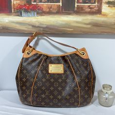 Gently Used, Good Condition, Clean Too :) Description Fit All Your Essentials In This Versatile Louis Vuitton Bag. The Price Of This Bag Will Only Increase. Color: Brown And Tan Approx Measurement : 18” X 13” X 6.5” Inches Strap Drop: 9” From The 2008 Collection Brass Hardware Tan Vachetta Leather Trim Logo Placard At Front Face Protective Feet At Base Beige Alcantara Lining Three Interior Pockets; One With Snap Closure At Flap And Magnetic Snap Closure At Top. Suggested Retail: Us$1460 In 2008, Tan Monogram Canvas Shoulder Bag, Gold Monogram Canvas Shoulder Bag For Daily Use, Luxury Brown Shoulder Bag For Errands, Designer Brown Shoulder Bag In Signature Coated Canvas, Brown Signature Coated Canvas Shoulder Bag With Gold-tone Hardware, Designer Brown Monogram Canvas Shoulder Bag, Brown Shoulder Bag In Signature Coated Canvas For Everyday, Brown Signature Coated Canvas Shoulder Bag For Everyday Use, Tan Monogram Canvas Shoulder Bag For Errands