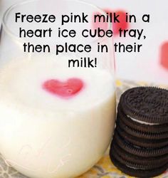 a glass of milk and some cookies on a table with the words freeze pink milk in a heart ice cube tray, then place in their milk