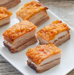 several pieces of food sitting on top of a white plate