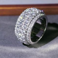 a diamond ring sitting on top of a table